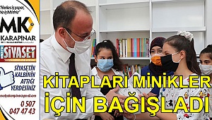 Kitapları minikler için yerleştirdi