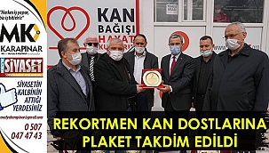 Rekortmen kan dostlarına plaket takdim edildi
