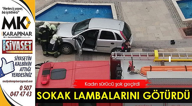 Kadın sürücü sokak lambalarını götürdü