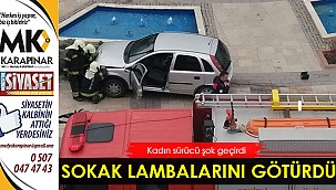 Kadın sürücü sokak lambalarını götürdü