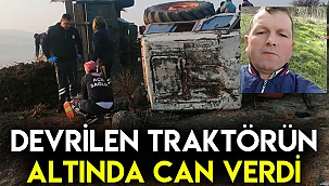 Devrilen traktörün altında can verdi