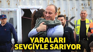 Yaraları sevgiyle sarıyor