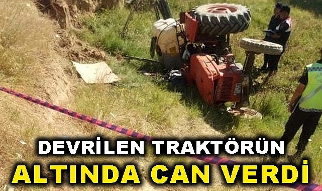 Devrilen traktörün altında can verdi