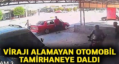 Virajı alamayan otomobil tamirhaneye daldı
