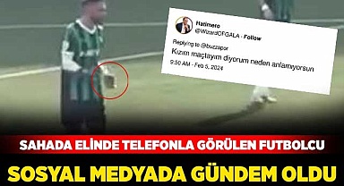 Sahada telefonla görülen futbolcu sosyal medyada gündem oldu